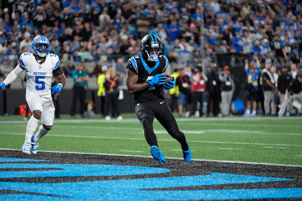 Carolina Panthers wide receiver Tetairoa McMillan (4) scores a touchdown during an NFL...