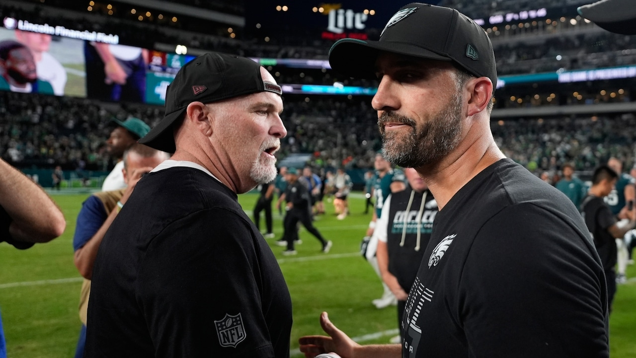 Washington Commanders head coach Dan Quinn, left, and Philadelphia Eagles head coach Nick Sirianni, right, greet at midfield after their NFL football game, Sunday, Sept. 13, 2026, in Philadelphia.
