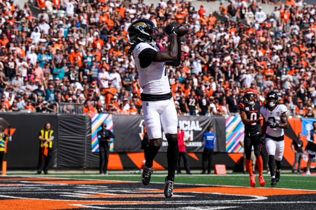 Jacksonville Jaguars wide receiver Brian Thomas Jr. catches a pass for a touchdown.