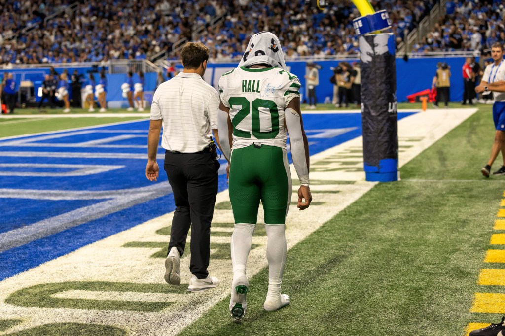 New York Jets running back Breece Hall leaves the game against the Detroit Lions at Ford Field.