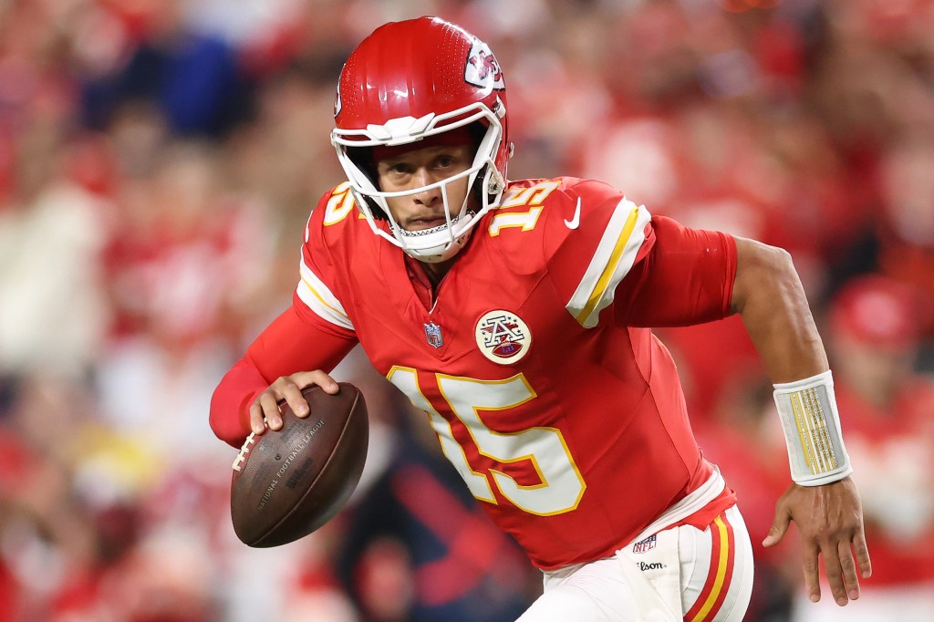 Kansas City Chiefs quarterback Patrick Mahomes scrambles with the football during a game against the Indianapolis Colts.