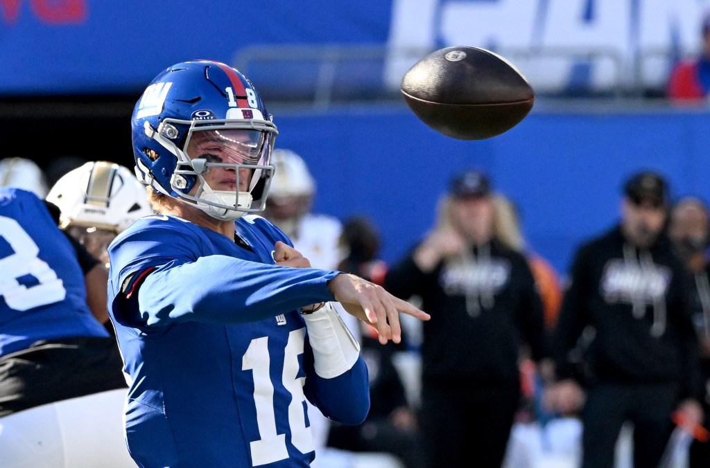 New York Giants quarterback J.J. McCarthy (18) passes a football during a game against the New Orleans Saints.