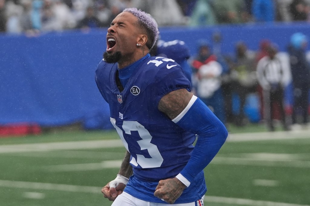 New York Giants wide receiver Odell Beckham Jr. screams as he runs onto the field.