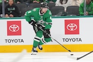 Dallas Stars defenseman Miro Heiskanen controls the puck during the first period of an NHL...