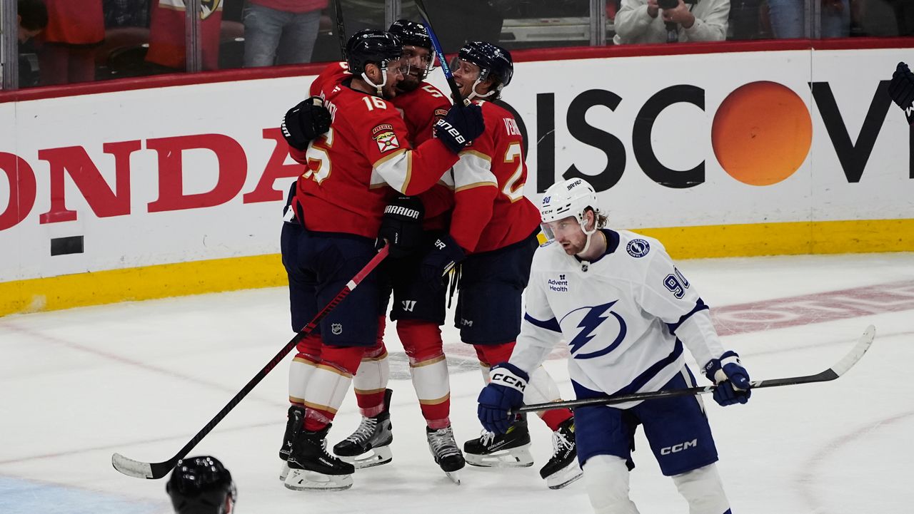 Florida Panthers defenseman Aaron Ekblad, top center, celebrates after his goal during the third period in Game 4 of an NHL hockey Stanley Cup first-round playoff series against the Tampa Bay Lightning, Monday, April 28, 2025, in Sunrise, Fla. (AP Photo/Marta Lavandier)