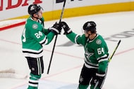 Dallas Stars center Roope Hintz (24) celebrates his empty net goal with center Mikael...