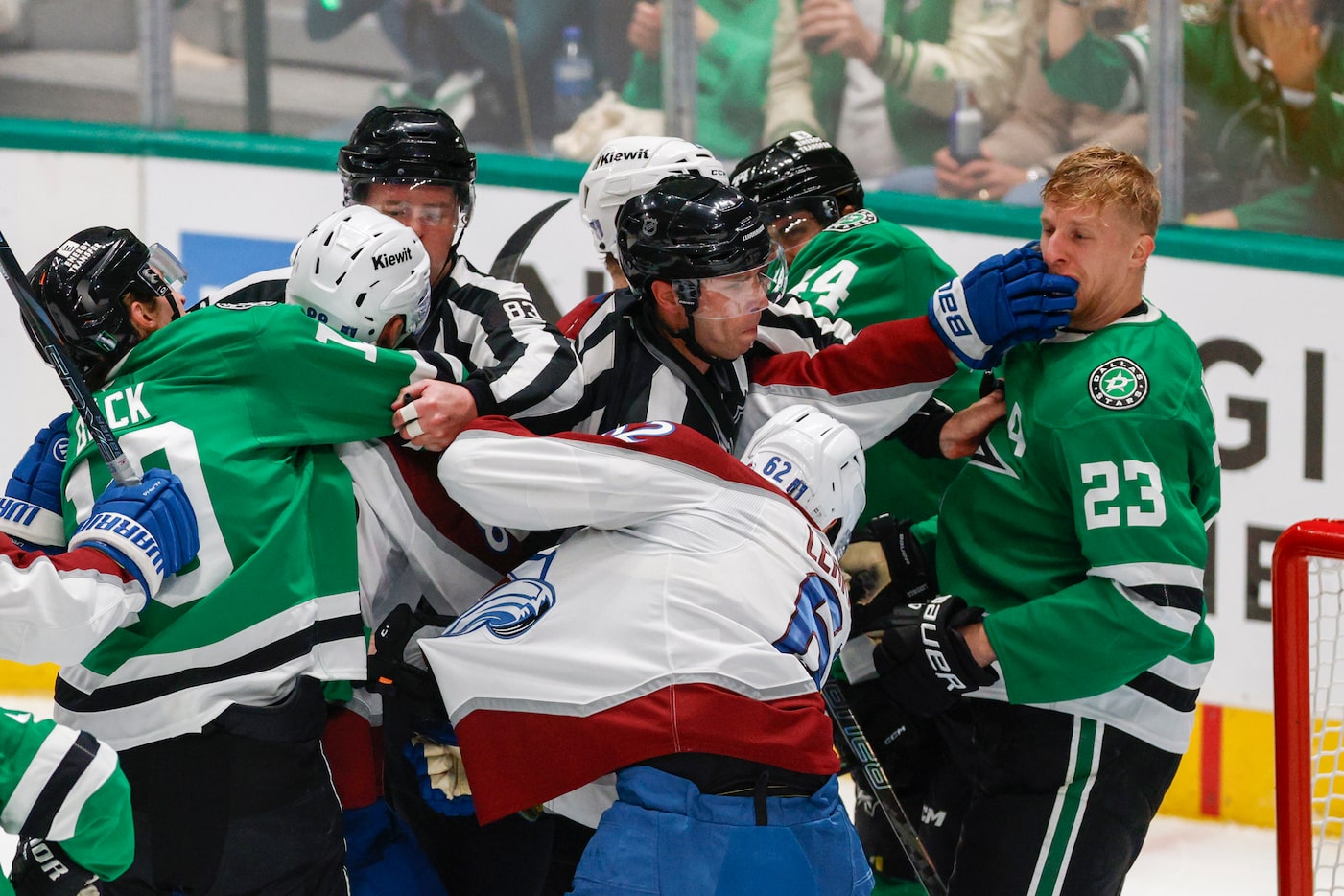 Colorado Avalanche center Nathan MacKinnon (29) hits Dallas Stars defenseman Esa Lindell...