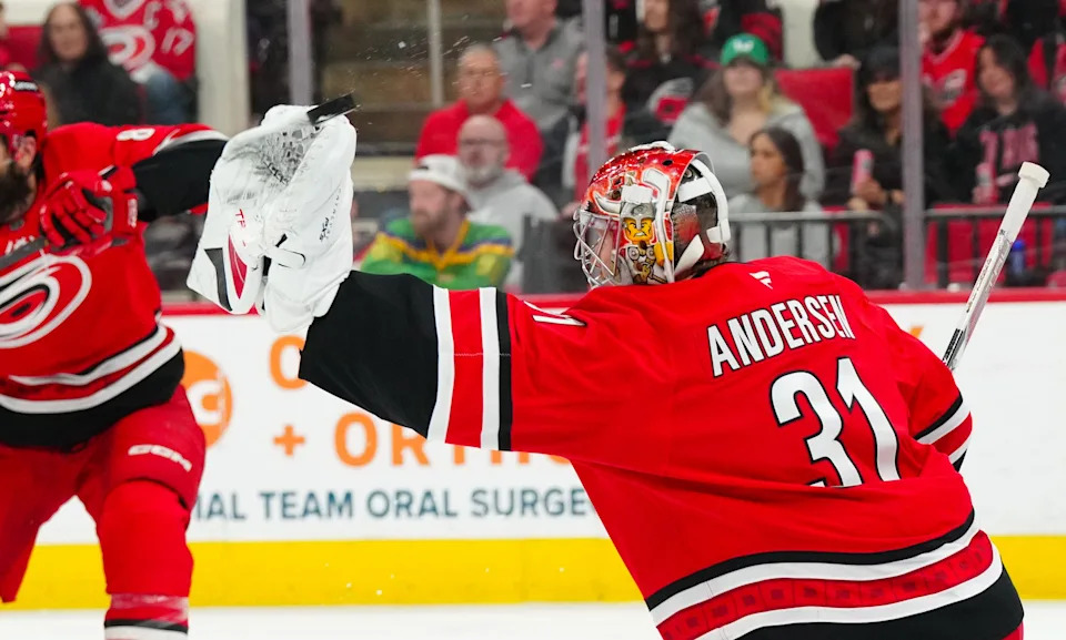 Carolina Hurricanes goaltender Frederik Andersen (31) reaches out for the shot against the Detroit Red Wings during the second period at Lenovo Center in Raleigh, North Carolina, on Friday, March 14, 2025.