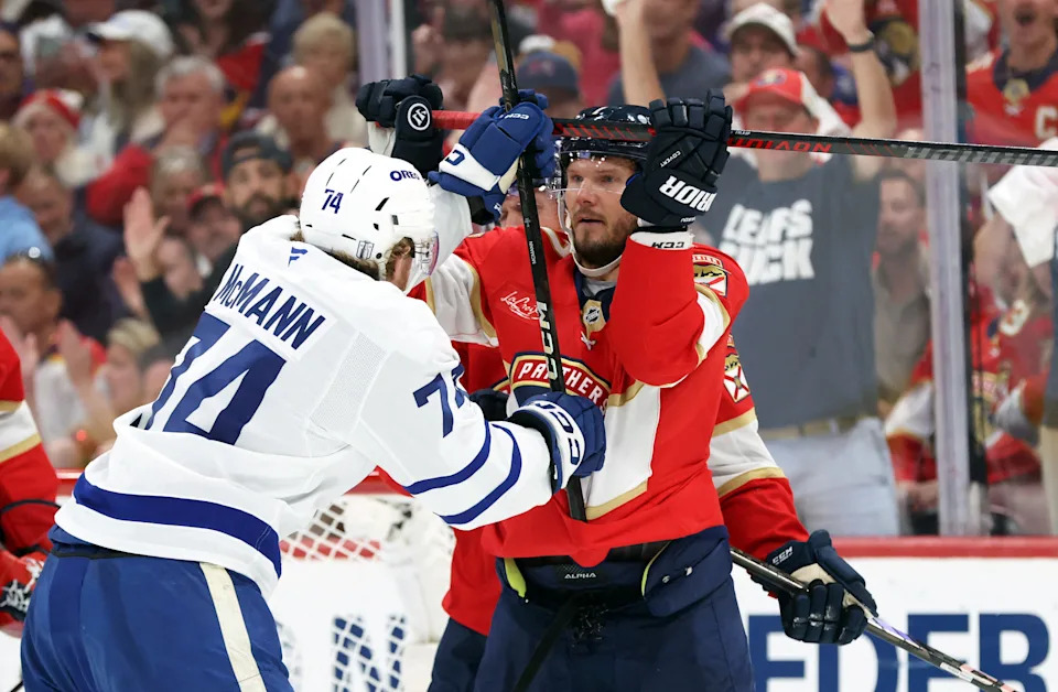 May 11, 2025; Sunrise, Florida, USA; Florida Panthers defenseman Dmitry Kulikov (7) and Toronto Maple Leafs center Bobby McMann (74) fight during the third period in game four of the second round of the 2025 Stanley Cup Playoffs at Amerant Bank Arena. Mandatory Credit: Kim Klement Neitzel-Imagn Images