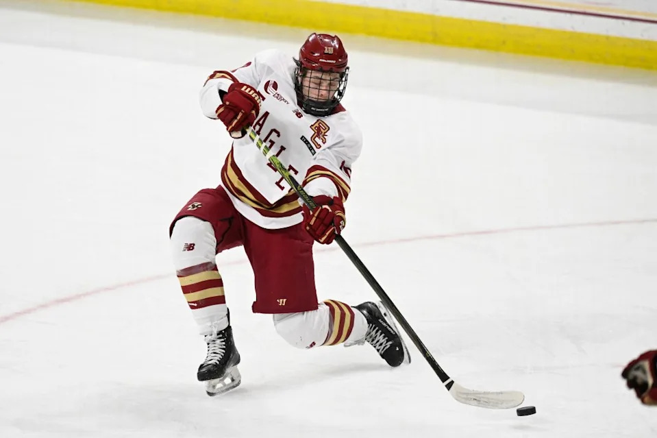 Boston College forward James Hagens (10) shoots the puck against the University of New Hampshire Wildcats during the third period at Conte Forum. Eric Canha-Imagn Images