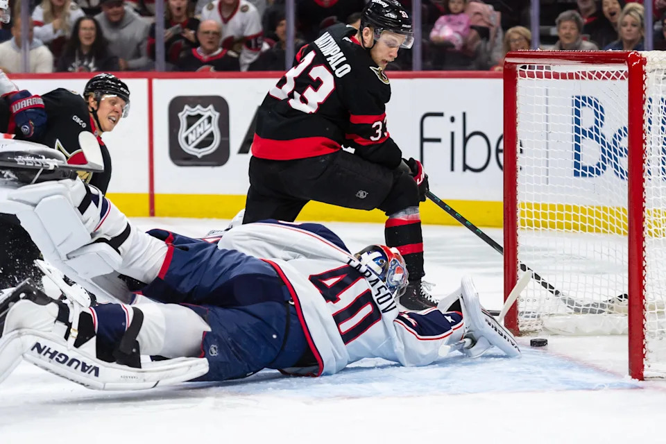 Apr 6, 2025; Ottawa, Ontario, CAN; Ottawa Senators defenseman Nikolas Martinpalo (33) scores against Columbus Blue Jackets goalie Daniil Tarasov (40) in the first period at the Canadian Tire Centre. Mandatory Credit: Marc DesRosiers-Imagn Images