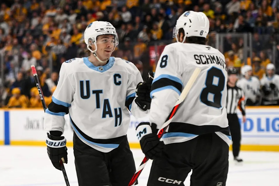 Utah Hockey Club center Nick Schmaltz (8) celebrates goal with center Clayton Keller (9) against the Nashville Predators during the second period at Bridgestone Arena.Steve Roberts-Imagn Images
