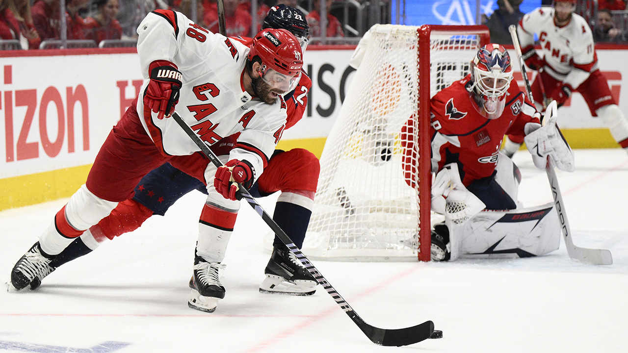 Carolina Hurricanes left wing Jordan Martinook skates with the puck against Washington on Tuesday night in Game 1.
