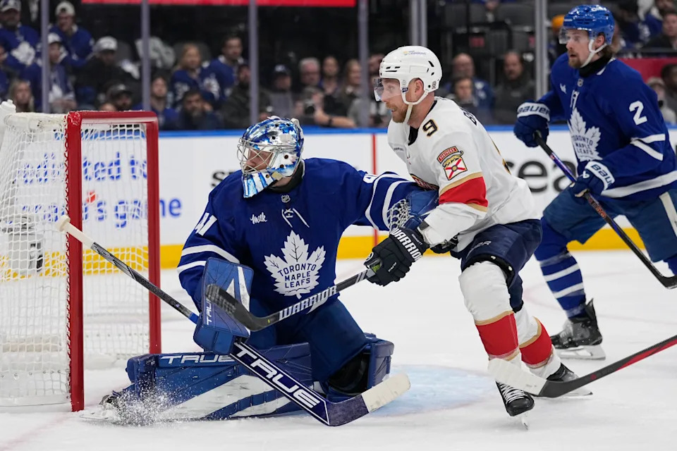 Toronto Maple Leafs goaltender Anthony Stolarz (41) and Florida Panthers forward Sam Bennett (9) battle for position in front of the goal.John E. Sokolowski-Imagn Images