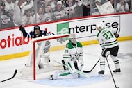 Winnipeg Jets' Mark Scheifele (55) celebrates after a goal by Nikolaj Ehlers against Dallas...