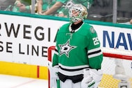Dallas Stars goaltender Jake Oettinger (29) looks to the video replay of Colorado...