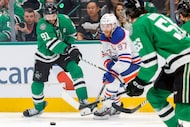 Dallas Stars center Tyler Seguin (91) battles with Edmonton Oilers center Connor McDavid...