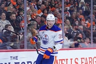 Edmonton Oilers' John Klingberg reacts after scoring a goal during the first period of an...
