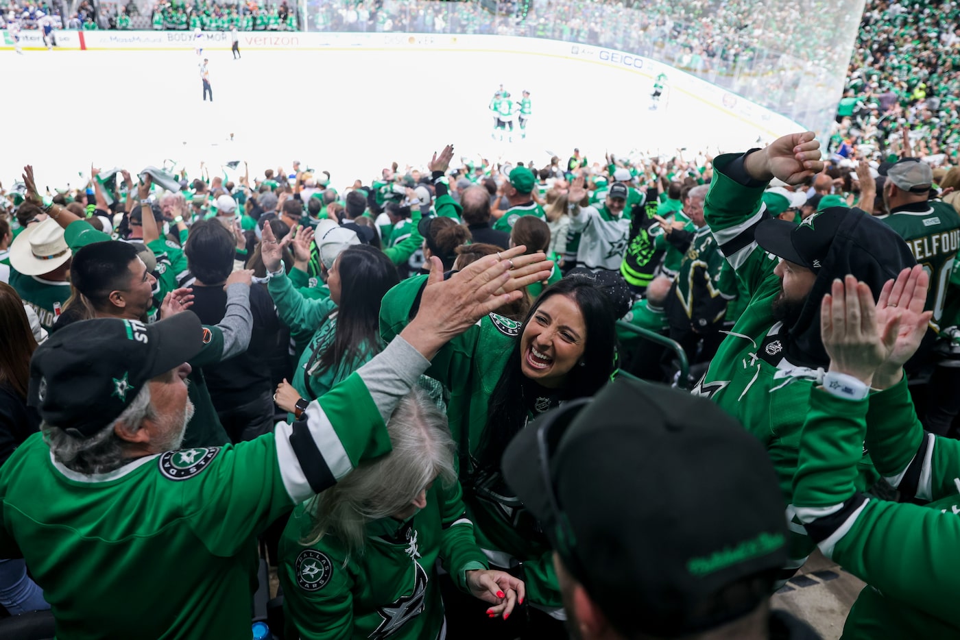 Fans cheer following a goal during the third period in Game 1 of the NHL Western Conference...