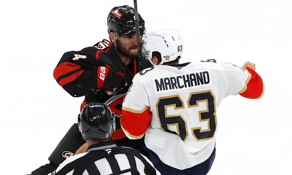 Carolina’s Shayne Gostisbehere (4) tangles with the PanthersÕ Brad Marchand (63) during the third period of the Florida PanthersÕ 5-2 victory over the Carolina Hurricanes in Game 1 of the Eastern Conference Finals at the Lenovo Center in Raleigh, N.C., Tuesday, May 20, 2025. Ethan Hyman/ehyman@newsobserver.com