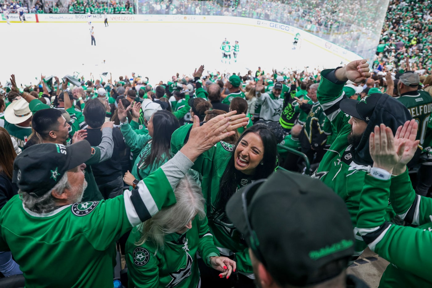 Dallas Stars fans celebrates after a Stars goal during the third period in Game 1 of the NHL...
