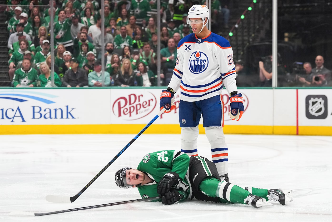 Dallas Stars center Roope Hintz (24) collapses to the ice after a slashing penalty by...