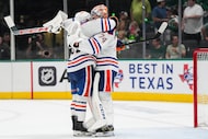 Edmonton Oilers goaltender Stuart Skinner (74) hugs left wing James Hamblin (52) after a 3-0...