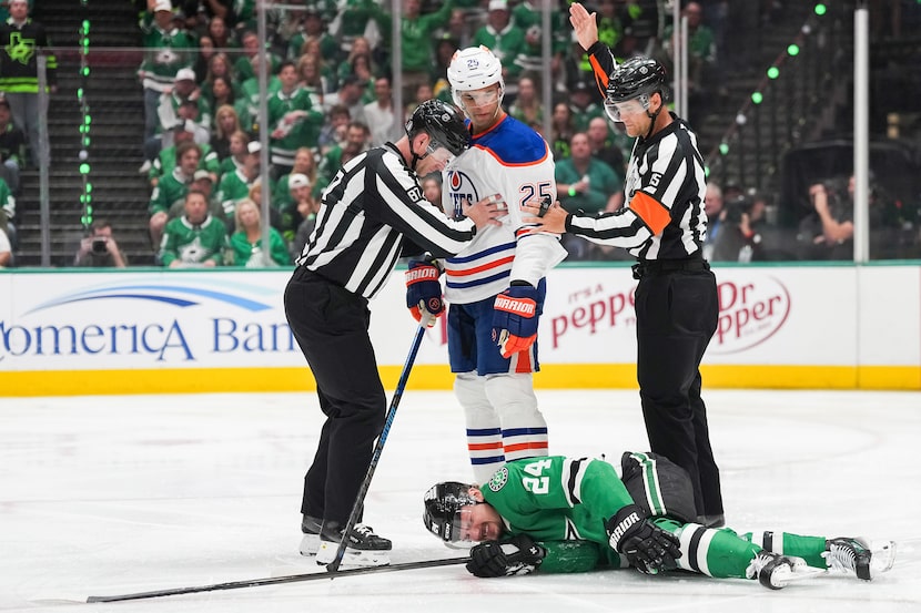 Dallas Stars center Roope Hintz (24) collapses to the ice after a slashing penalty by...