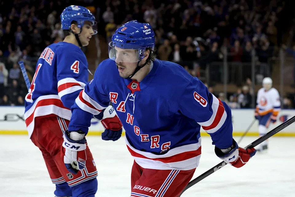 Mar 3, 2025; New York, New York, USA; New York Rangers left wing J.T. Miller (8) celebrates his goal against the New York Islanders with defenseman Braden Schneider (4) during the third period at Madison Square Garden. Mandatory Credit: Brad Penner-Imagn Images