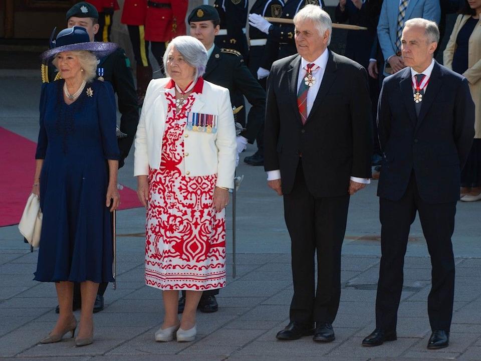 Queen Camilla, Gov. Gen. Mary Simon, her husband, Whit Fraser, and Prime Minister Mark Carney at the Senate building in Ottawa on Tuesday.