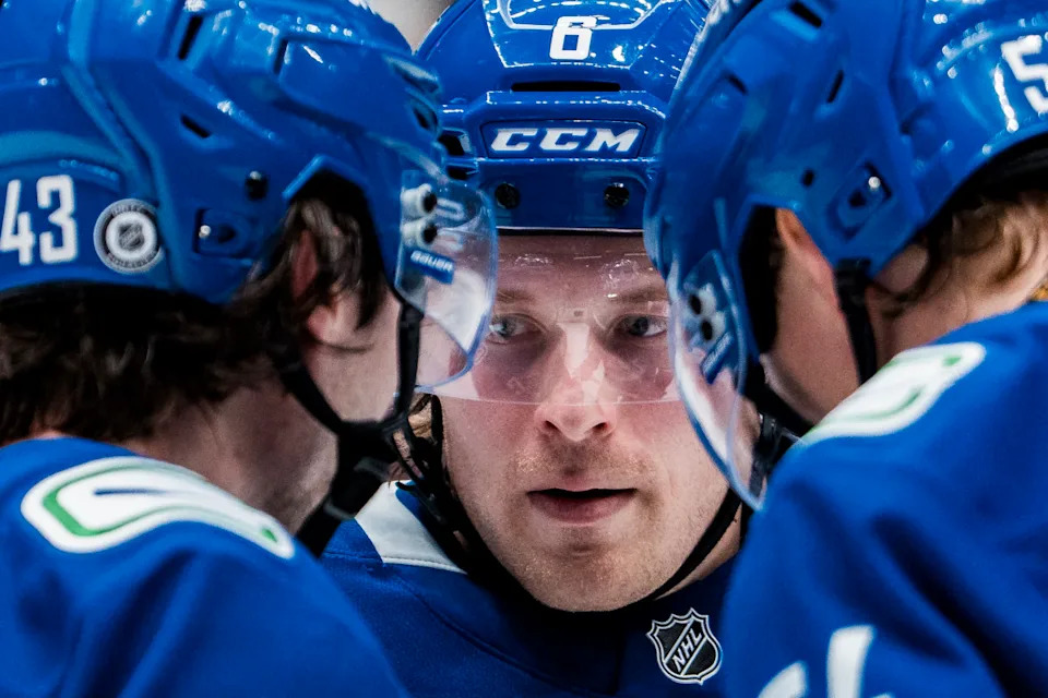 Vancouver Canucks forward Brock Boeser (6) talks face-off strategy with teammates Quinn Hughes (43) and Aatu Raty (54).Bob Frid-Imagn Images