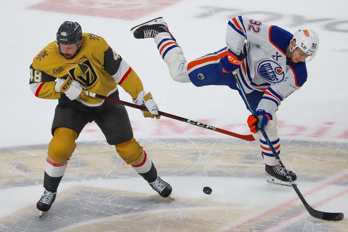 Vegas Golden Knights center Thomas Hertl (48) and Edmonton Oilers  right wing Vasily Podkolzin (92) reach for thee puck after coliding during first period of NHL playoff game against Edmonton Oilers on Tuesday May 6, 2025 in Las Vegas.