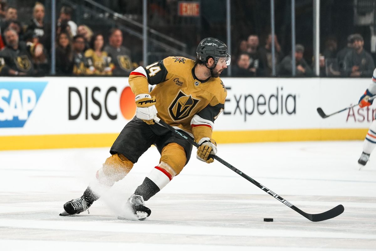 Vegas Golden Knights defenseman Nicolas Hague (14) skates the puck down the ice during second period of NHL playoff game against Edmonton Oilers on Tuesday May 6, 2025 in Las Vegas.