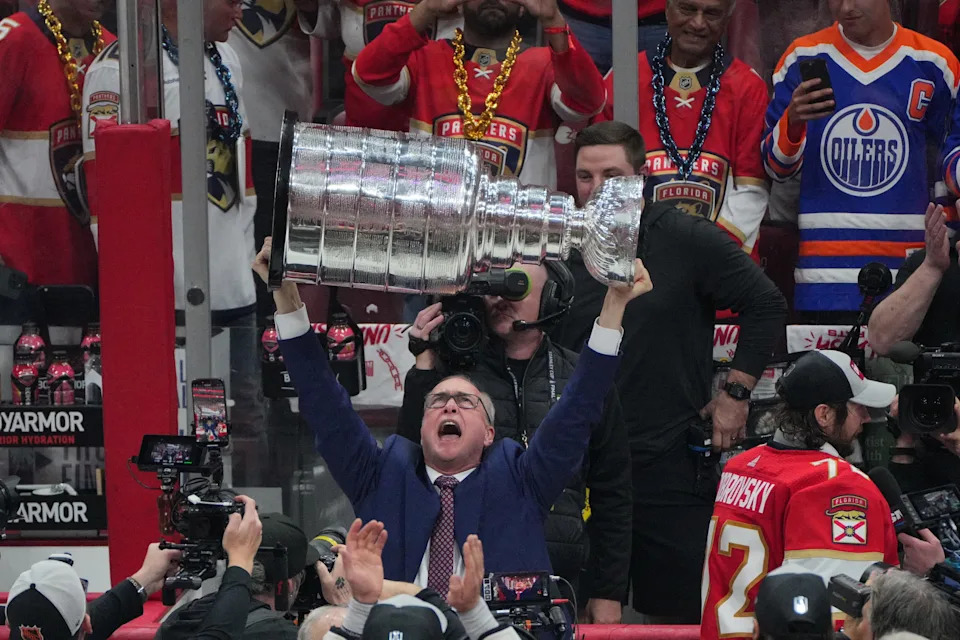 Jun 24, 2024; Sunrise, Florida, USA; Florida Panthers head coach Paul Maurice hoists the Stanley Cup after defeating Edmonton Oilers in game seven of the 2024 Stanley Cup Final at Amerant Bank Arena. Mandatory Credit: Jim Rassol-USA TODAY Sports