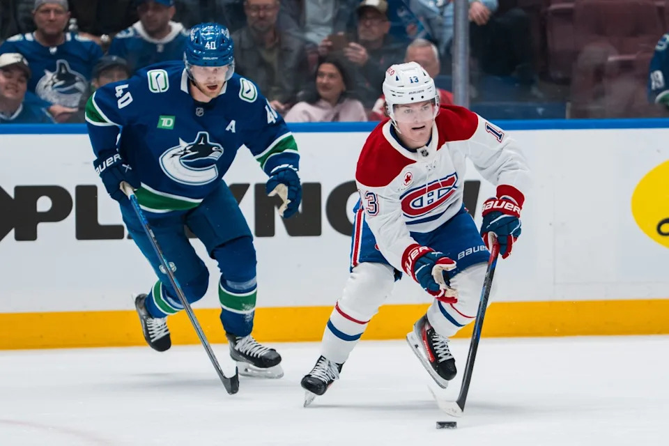Vancouver Canucks forward Elias Pettersson (40) pursues Montreal Canadiens forward Cole Caufield (13) in the first period at Rogers Arena. Bob Frid-Imagn Images