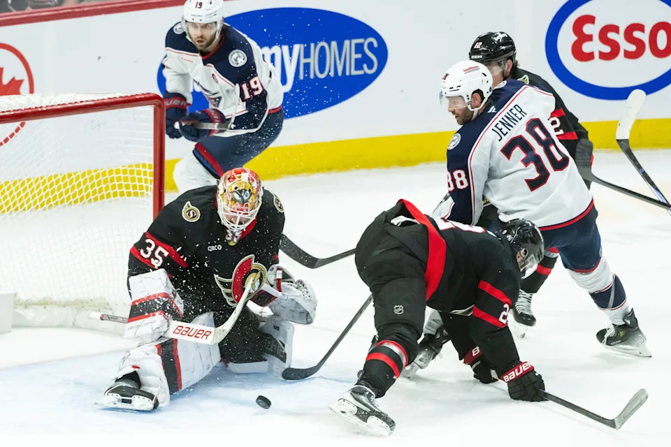 Apr 6, 2025; Ottawa, Ontario, CAN; Ottawa Senators goalie Linus Ullmarlk (35) makes a save on a shot from Columbus Blue Jackets center Boone Jenner (38) in the third period at the Canadian Tire Centre. Mandatory Credit: Marc DesRosiers-Imagn Images