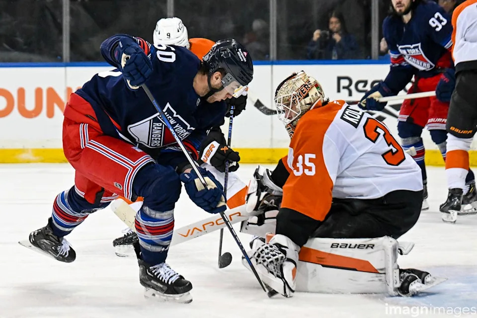Apr 9, 2025; New York, New York, USA; Philadelphia Flyers goaltender Aleksei Kolosov (35) makes a save on New York Rangers left wing Will Cuylle (50) during the second period at Madison Square Garden.