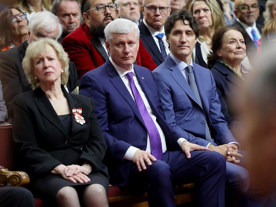 Left to right, Kim Campbell, Stephen Harper, Justin Trudeau and Margaret Trudeau listen as King Charles III opens the 45th Parliament of Canada by delivering the speech from the throne on Tuesday.