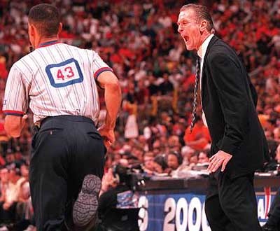 Pat Riley screams at official Dan Crawford as he runs by him during Game 7 of the Heat-Knicks playoff series in 2000.