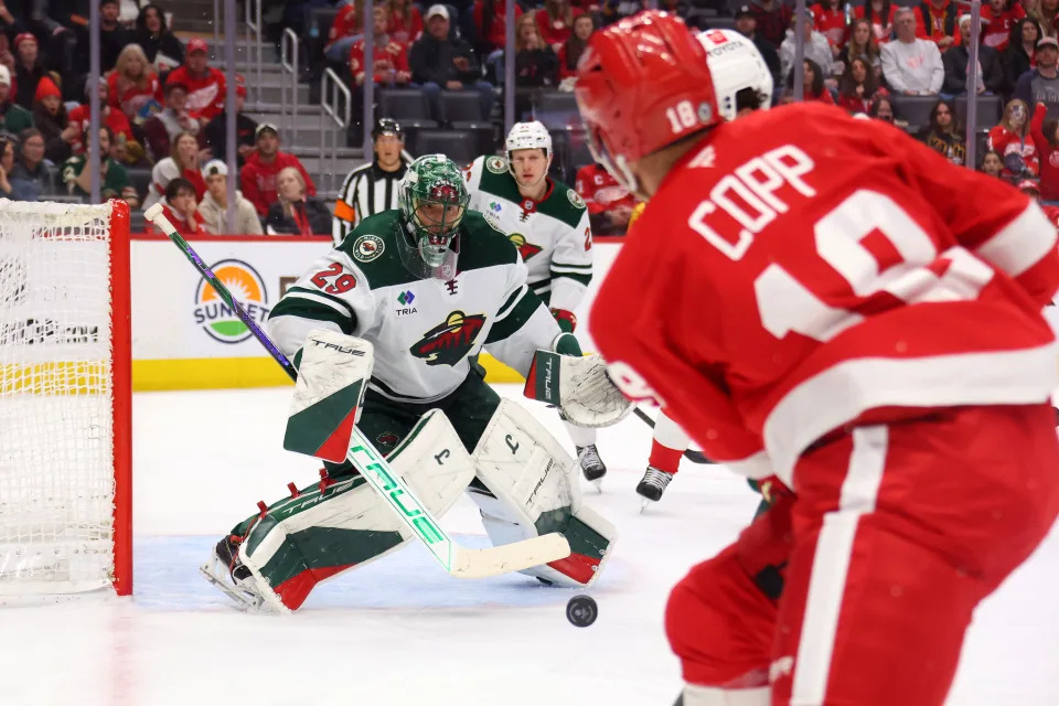 Marc-Andre Fleury of the Minnesota Wild keeps an eye on the puck behind Andrew Copp of the Detroit Red Wings during the second period at Little Caesars Arena on Feb. 22, 2025 in Detroit.