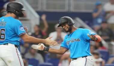 Miami Marlins' Otto Lopez, right, celebrates with Matt Mervis, left, after hitting a three-run home run during the fourth inning of a baseball game against the Tampa Bay Rays, Sunday, May 18, 2025, in Miami. (AP Photo/Marta Lavandier)