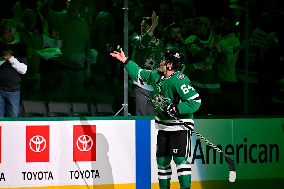 Dallas Stars center Mikael Granlund (64) tosses a puck to a fan after the Stars defeat the Winnipeg Jets at American Airlines Center.Jerome Miron-Imagn Images
