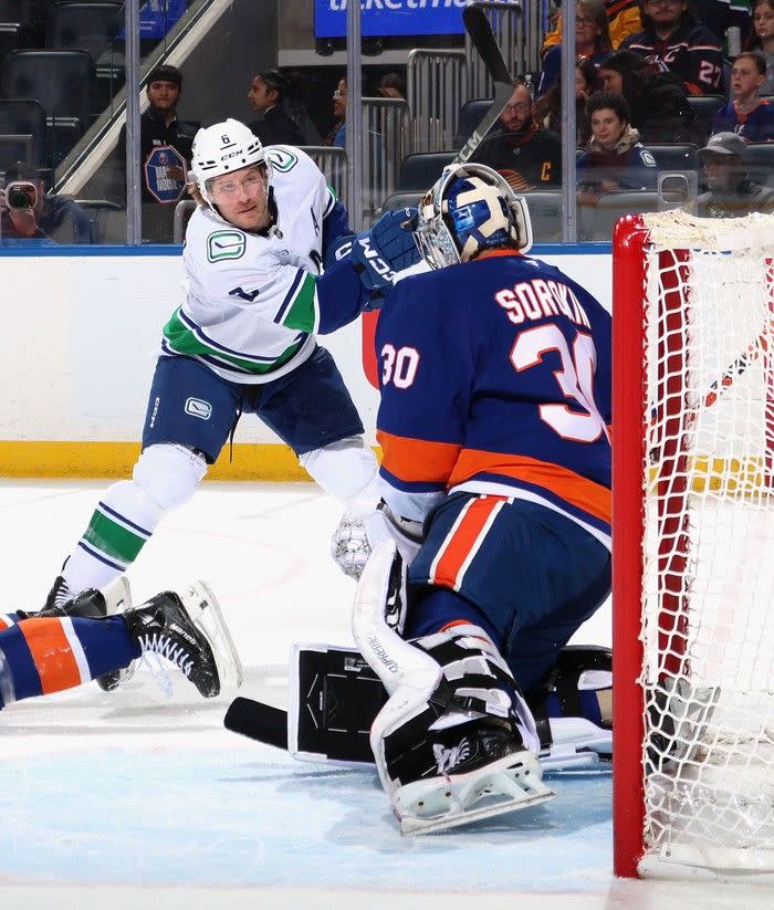  Winger Brock Boeser tests goaltender Ilya Sorokin of the Islanders during first period on March 26 at Elmont, N.Y.