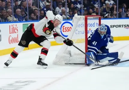 Ottawa Senators forward Brady Tkachuk attempting a wrap-around against Toronto Maple Leafs goaltender Anthony Stolarz
