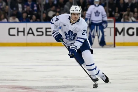 Toronto Maple Leafs forward Scott Laughton traversing the neutral zone with the puck during a road game against the New York Rangers. Toronto Maple Leafs forward Scott Laughton traversing the neutral zone with the puck during a road game against the New York Rangers.