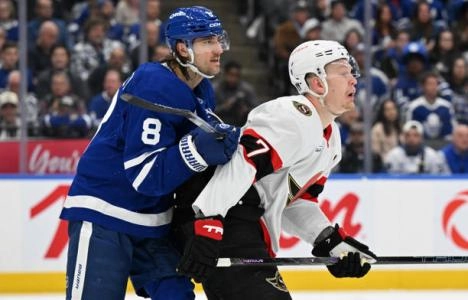 Ottawa Senators forward Brady Tkachuk and Toronto Maple Leafs defenseman Chris Tanev battling for position. Ottawa Senators forward Brady Tkachuk and Toronto Maple Leafs defenseman Chris Tanev battling for position.