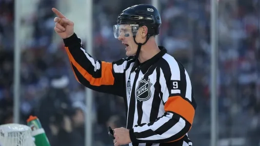 NHL official Dan O'Rourke making a call in-game.