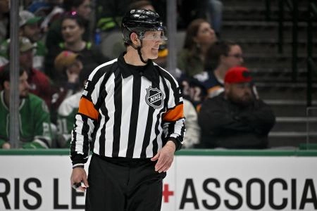 NHL official Wes McCauley officiating during a game between the Dallas Stars and Colorado Avalanche. NHL official Wes McCauley officiating during a game between the Dallas Stars and Colorado Avalanche.