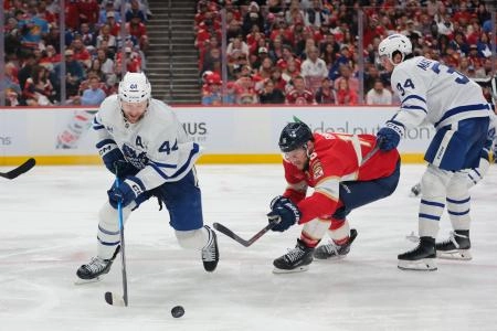 Toronto Maple Leafs defenseman Morgan Rielly attempting to get around Florida Panthers forward Aleksander Barkov. Toronto Maple Leafs defenseman Morgan Rielly attempting to get around Florida Panthers forward Aleksander Barkov.