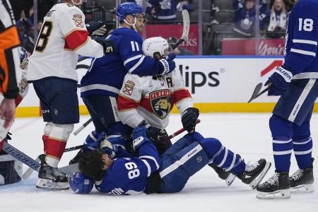 Toronto Maple Leafs forward Max Domi and Florida Panthers defenseman Aaron Ekblad getting into it after a whistle.